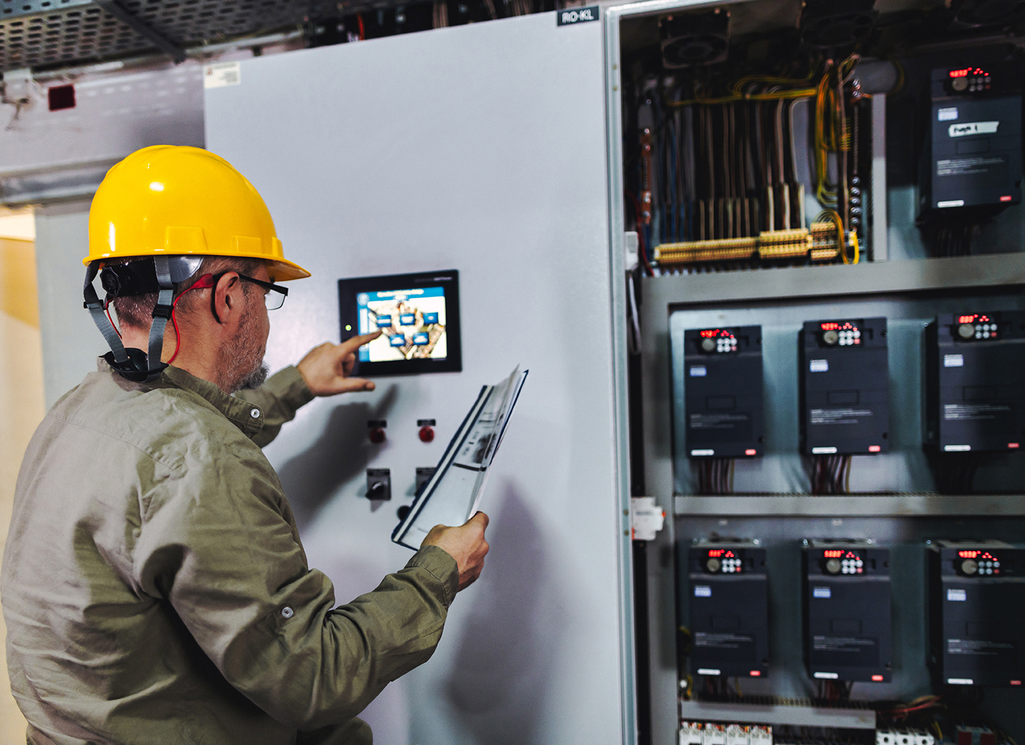 Engineer interfacing with an industrial HMI